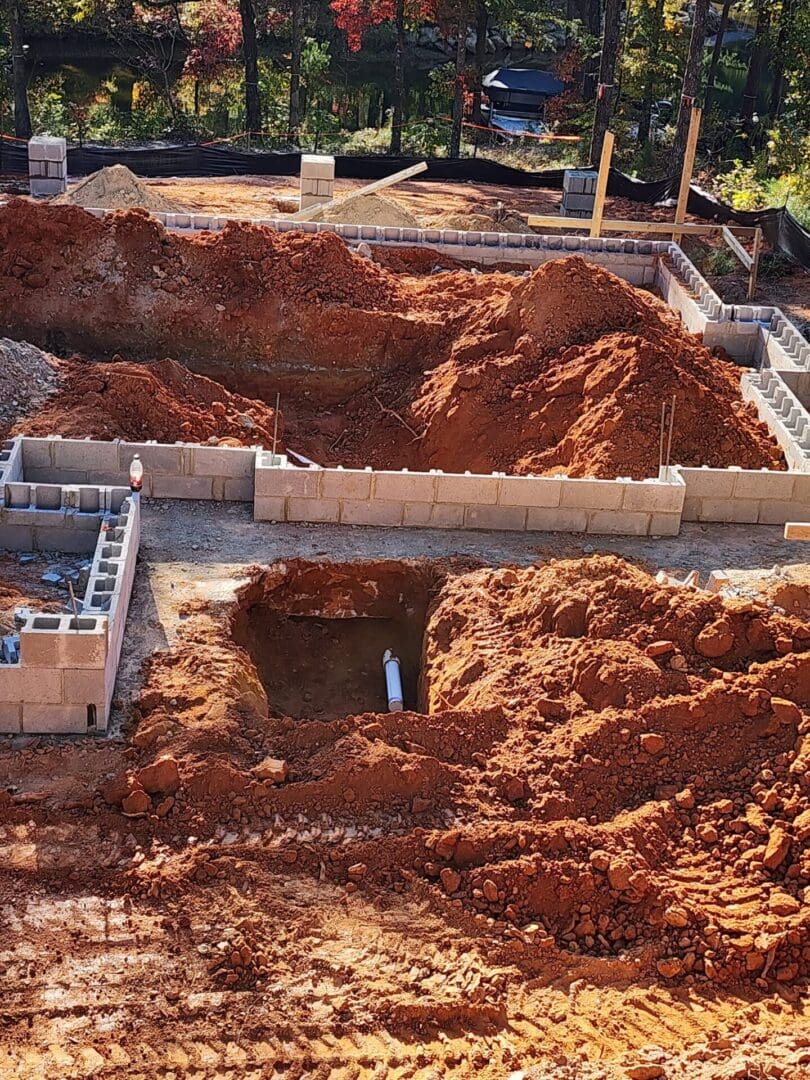 A pile of dirt in the middle of a construction site.