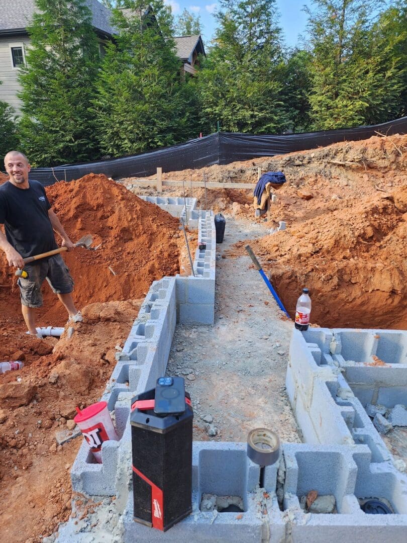 A man is working on the construction of a house.